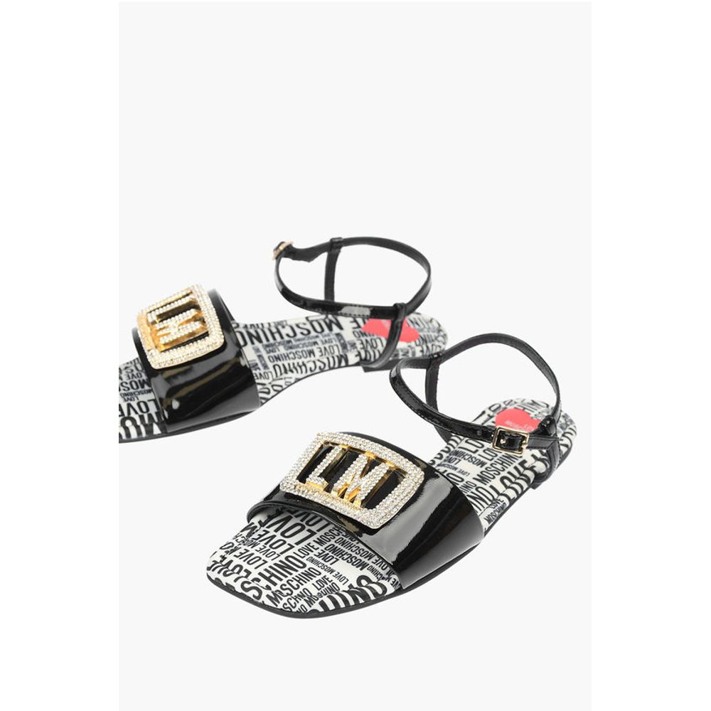 Moschino LOVE Patent Leather Flat Sandals with Logoed Jewel Detail